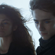 Zendaya's Chani and Timothée Chalamet Paul are windswept and wearing all black in Dune.